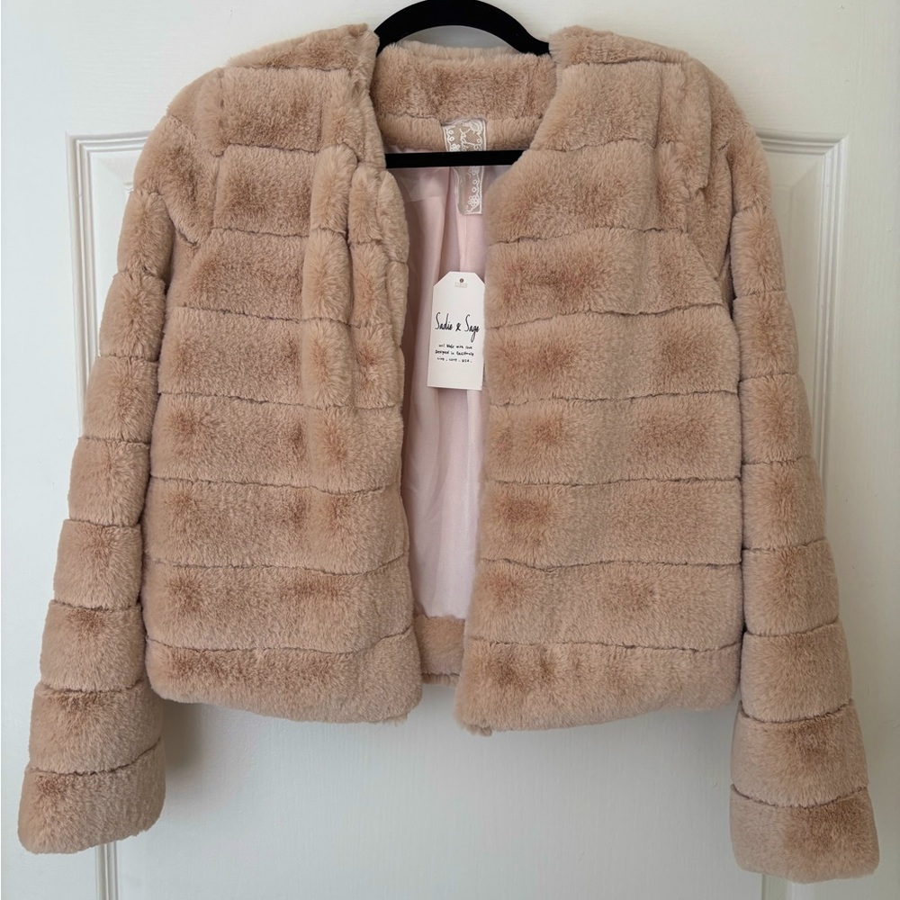 Plush Faux Fur Coat. Keep warm and posh in this beautiful, soft faux fur coat.